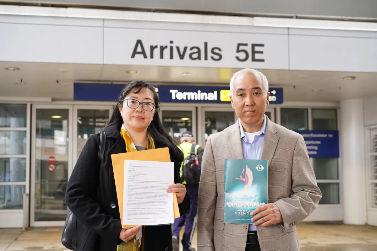 Yi Liu (L) and Andrew Tu, president and vice president of the Mid-USA Falun Dafa Association, in front of Terminal 5 at the O’Hare International Airport in Chicago on March 26, 2024. (Cara Ding/The Epoch Times)