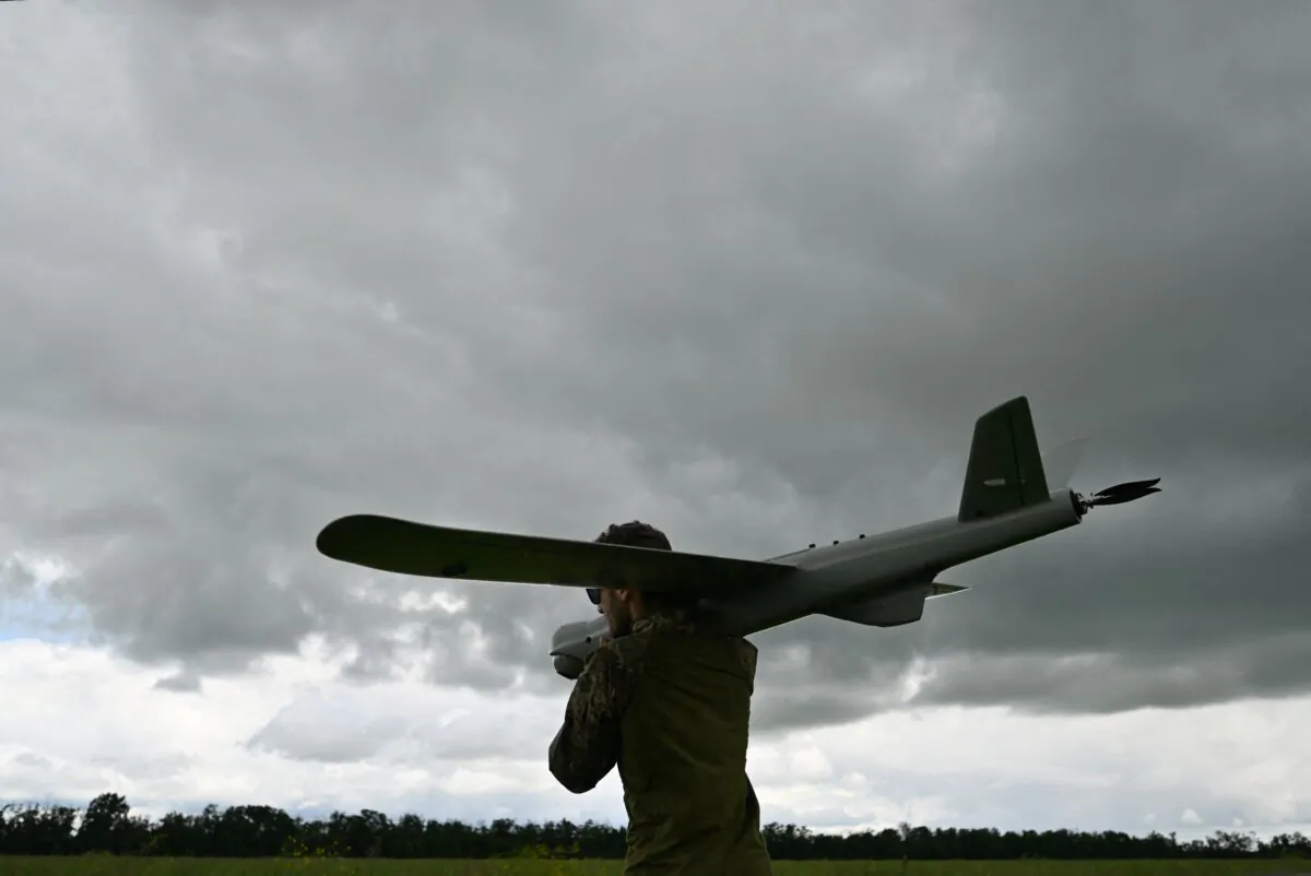 A Ukrainian serviceman of an air reconnaissance squad of the 45th Brigade prepares to launch a Leleka reconnaissance UAV on a position in Donetsk region on June 27, 2023. (Genya Savilov/AFP via Getty Images) 