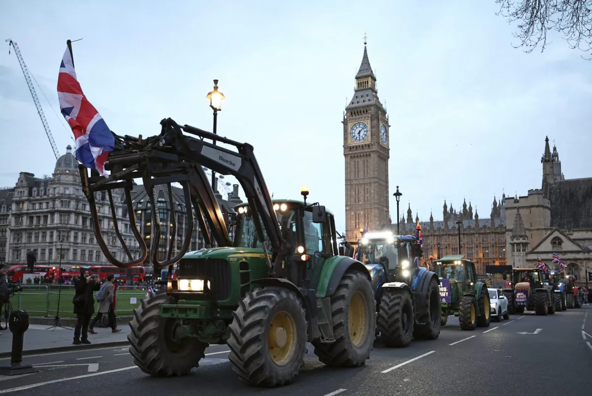 Farmers drive tractors around Parliament Square during a demonstration organised by Save British Farming against UK food policy, substandard imports, and stricter food labelling regulations, in central London on March 25, 2024. (Henry Nicholls/AFP via Getty Images)