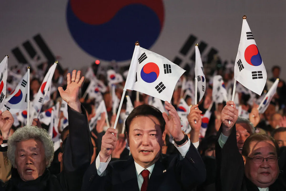 South Korea's President Yoon Suk Yeol (C) gives three cheers during a ceremony marking the 105th anniversary of the March 1st Independence Movement Day in Seoul, on March 1, 2024. (Kim Hong-Ji/Pool/AFP via Getty Images)