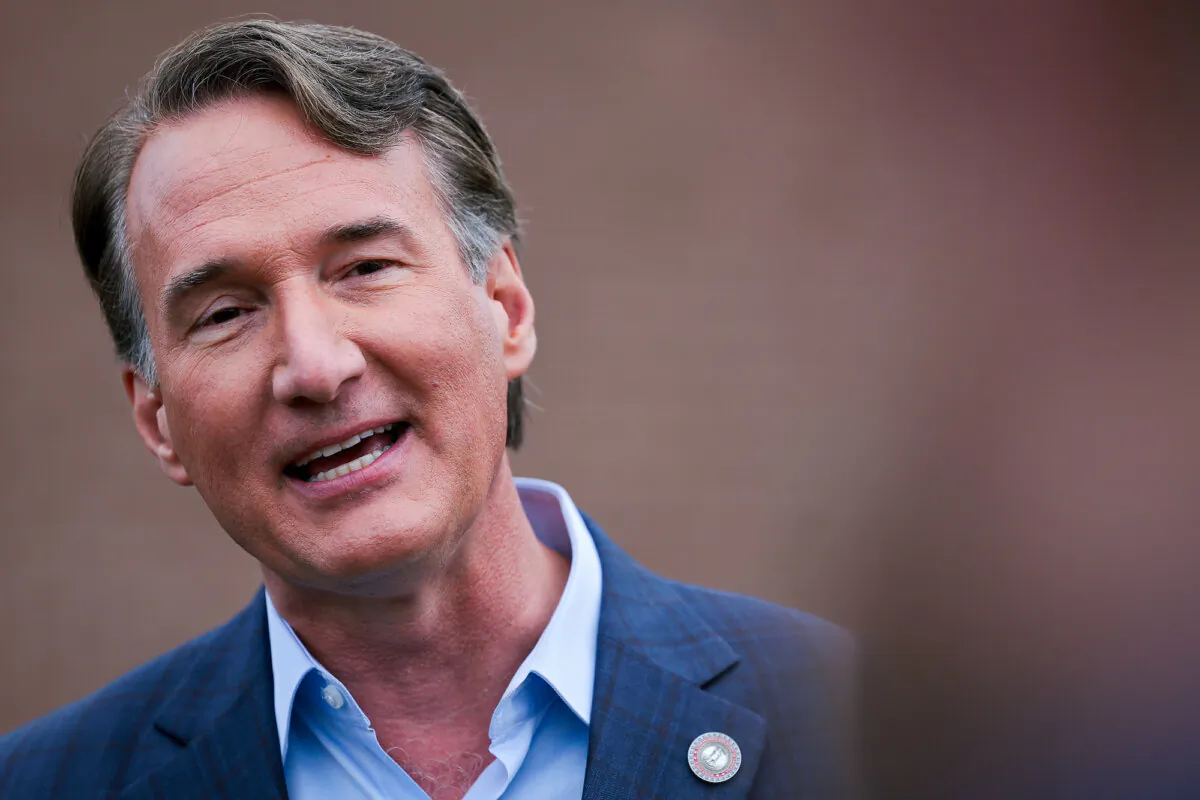 Virginia Gov. Glenn Youngkin answers questions from members of the media while campaigning at Piney Branch Elementary School in Bristow, Va., Nov. 7, 2023. (Win McNamee/Getty Images)