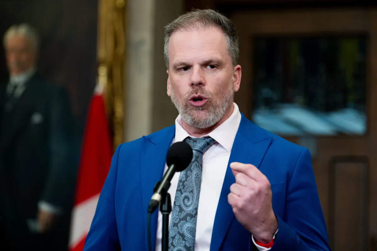 Mark Holland, Minister of Health, speaks to reporters in the Foyer of the House of Commons on Parliament Hill in Ottawa, on March 20, 2024. (The Canadian Press/Spencer Colby)