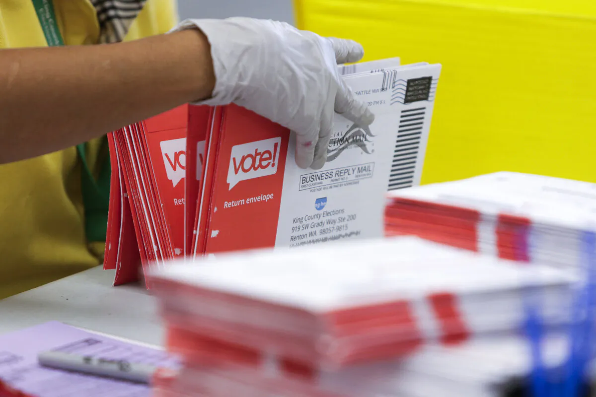 Mail-in-ballots in a file photo. (Jason Redmond/AFP via Getty Images)