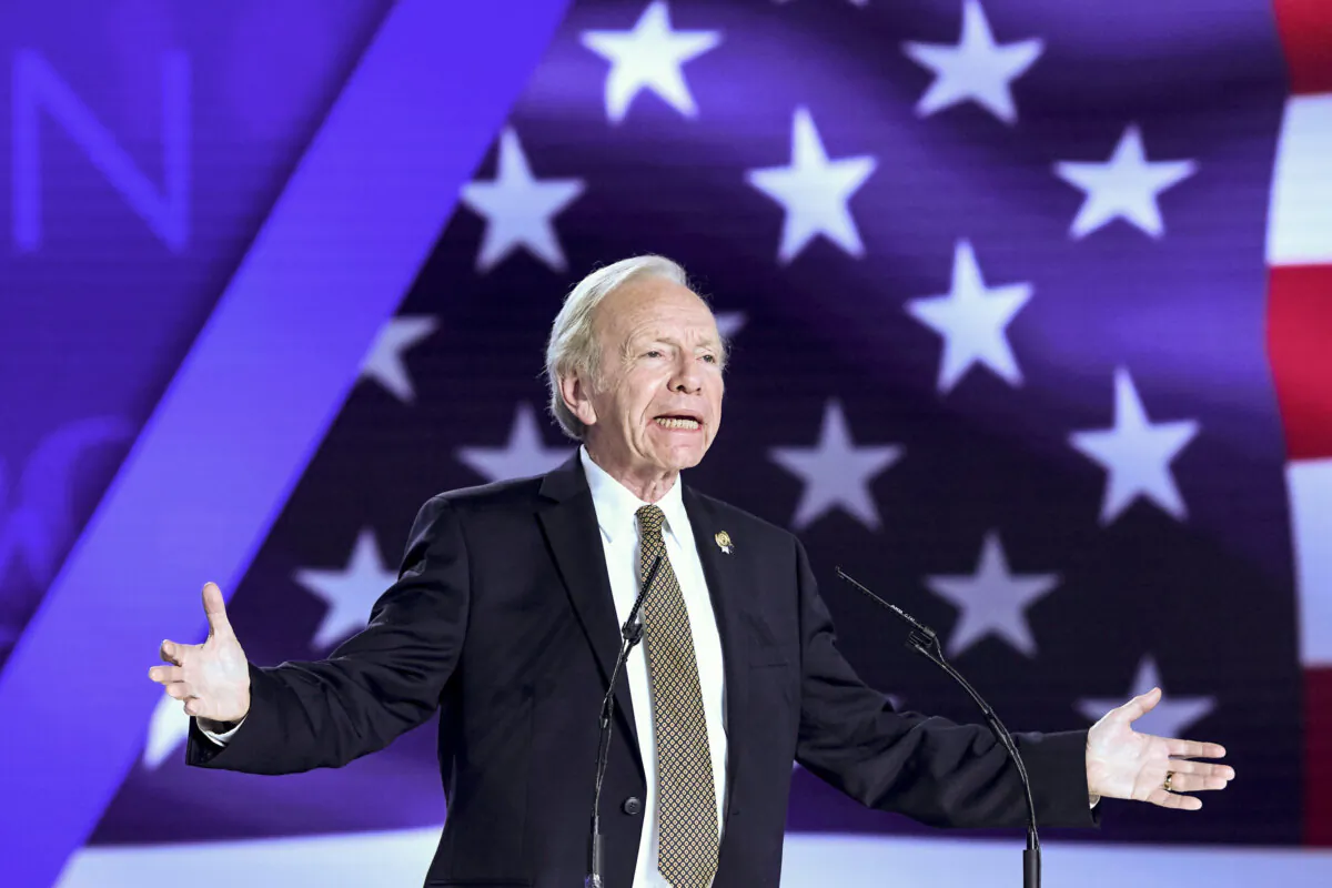 Former U.S. Senator Joe Lieberman gestures as he speaks during a conference "120 Years of Struggle for Freedom Iran" at Ashraf-3 camp, which is a base for the People's Mojahedin Organization of Iran (MEK) in Albanian town of Manza, on July 13, 2019. (Gent Shkullaku/AFP/Getty Images)