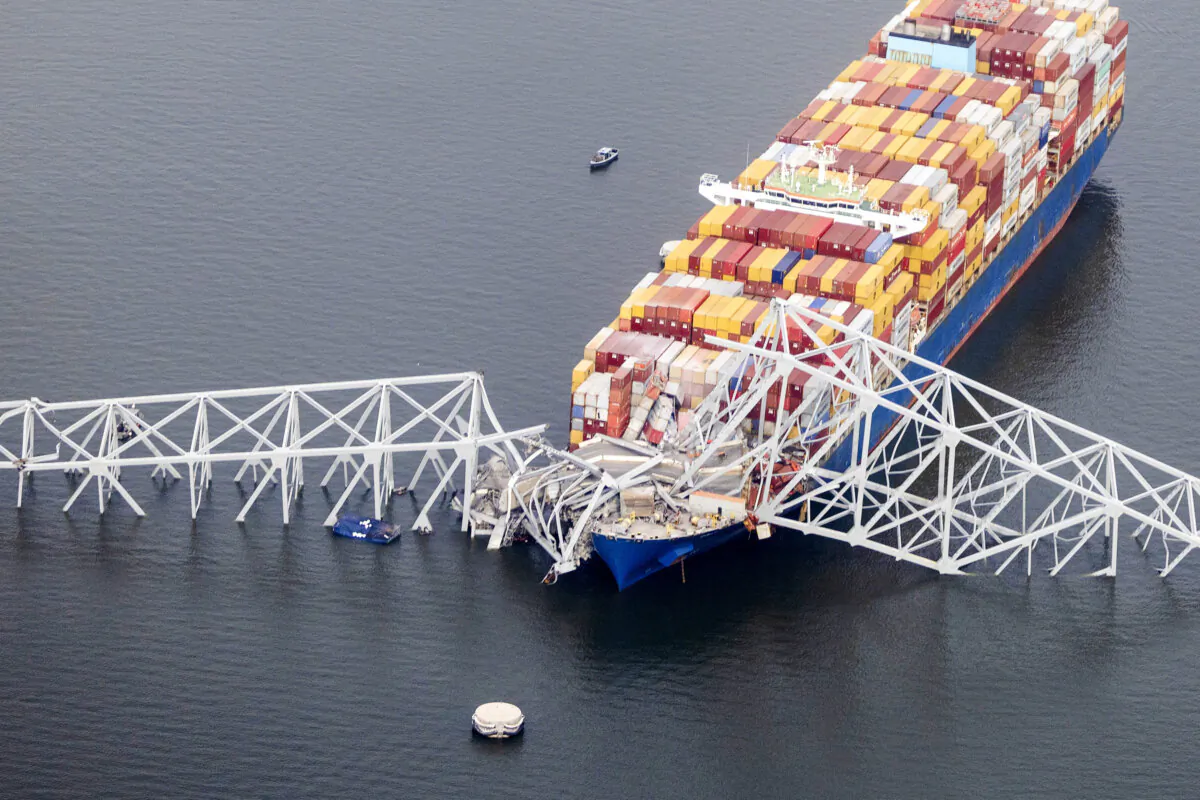In an aerial view, the cargo ship Dali sits in the water after running into and collapsing the Francis Scott Key Bridge in Baltimore, Md., on March 26, 2024. (Tasos Katopodis/Getty Images)