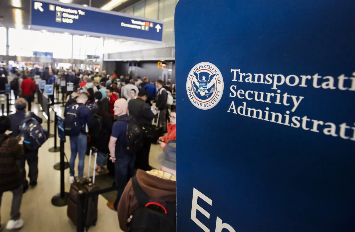 Passengers at O'Hare International Airport wait in line to be screened at a Transportation Security Administration checkpoint, in Chicago, Illinois, on May 16, 2016. (Scott Olson/Getty Images)
