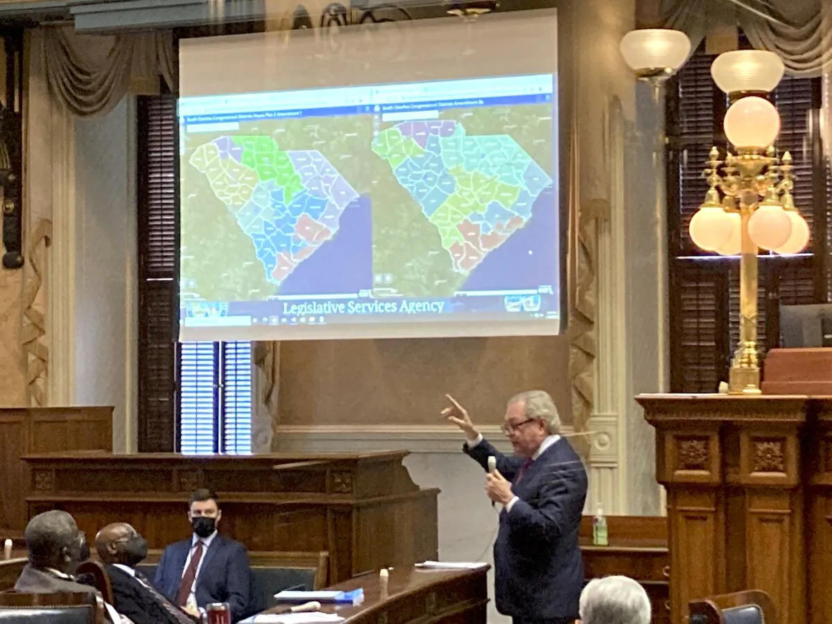 Sen. Dick Harpootlian (D-S.C.) compares his proposed map of House districts drawn with 2020 Census data to a plan supported by Republicans in Columbia, S.C., on Jan. 20, 2022. (Jeffrey Collins/AP Photo)