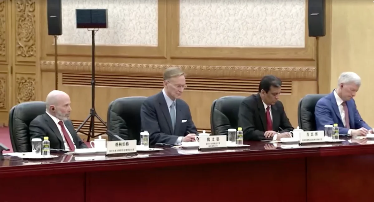 (L–R) Evan Greenberg, chairman of National Committee on U.S.–China Relations, Graham Allison, founding dean of Harvard's John F. Kennedy School of Government, Wendell Weeks, Corning's CEO, in Beijing, China, on March 27, 2024. (CCTV Via Reuters/Screenshot via The Epoch Times)