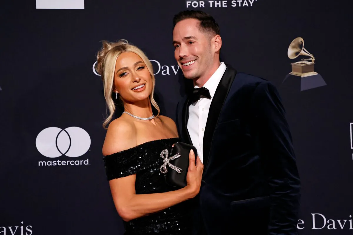 U.S. socialite Paris Hilton (L) and husband U.S. author Carter Reum arrive for the Recording Academy and Clive Davis pre-Grammy gala at the Beverly Hilton hotel in Beverly Hills, Calif., on Feb. 4, 2023. (Michael Tran/AFP via Getty Images)
