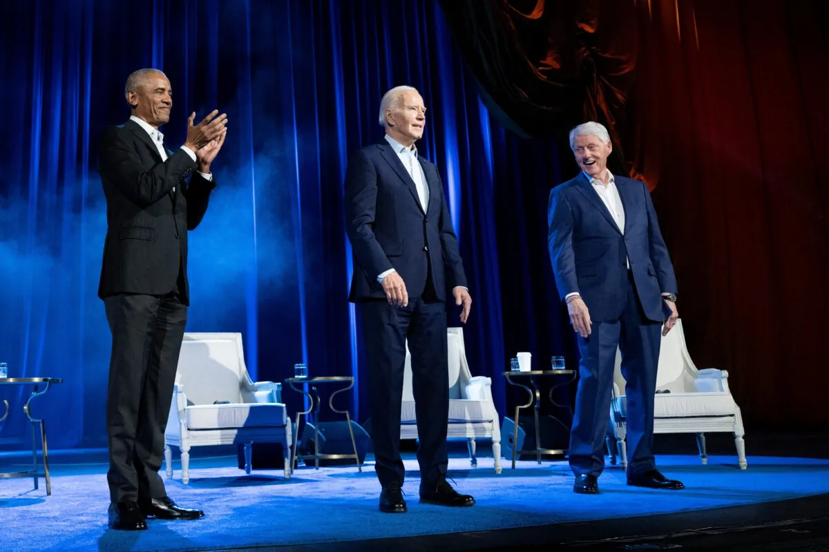 Former President Barack Obama (L) and former President Bill Clinton (R) cheer for President Joe Biden during a campaign fundraising event at Radio City Music Hall in New York City on March 28, 2024. (Brendan Smialowski/AFP via Getty Images)