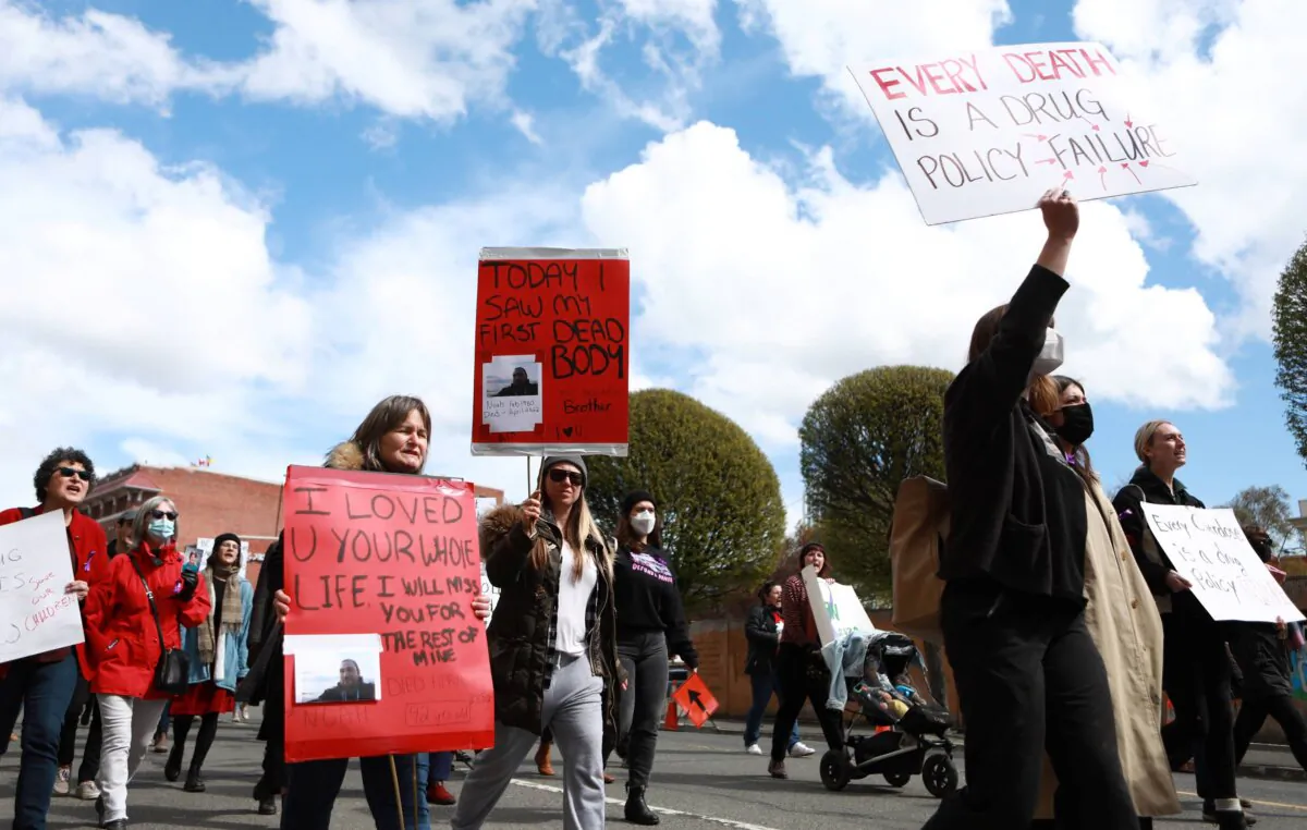 People march in protest of the significant increase in opioid-related overdose deaths across British Columbia, in Victoria on April 14, 2022. (The Canadian Press/Chad Hipolito)