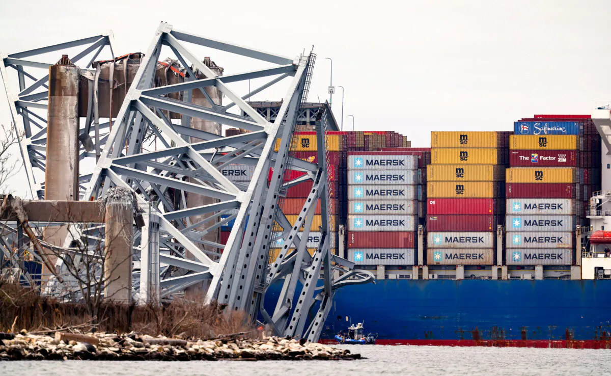 The cargo ship Dali sits in the water after running into and collapsing the Francis Scott Key Bridge in Baltimore, Maryland on March 26, 2024. (Kevin Dietsch/Getty Images)