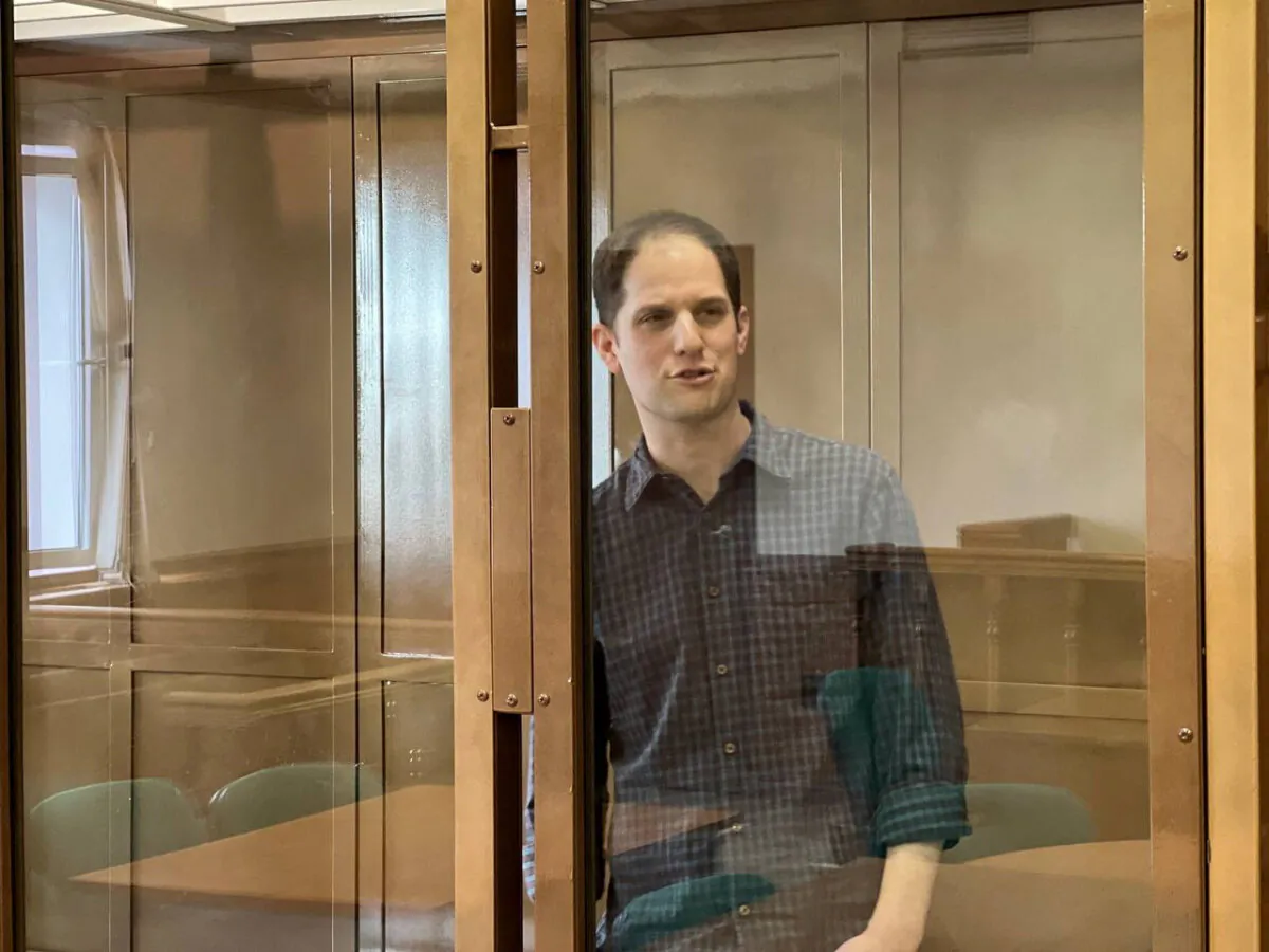 Wall Street Journal reporter Evan Gershkovich stands behind a glass wall of an enclosure for defendants as he attends a court hearing in Moscow, Russia, on March 26, 2024. (Moscow City Court's Press Office/Handout via Reuters)