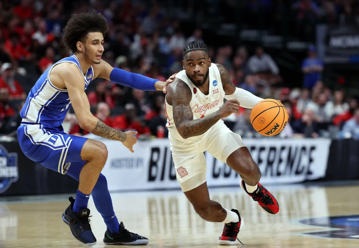 Jamal Shead (1) of the Houston Cougars drives to the basket as Tyrese Proctor (5) of the Duke Blue Devils defends during the 1st half of the Sweet 16 round of the NCAA Men's Basketball Tournament in Dallas on March 29, 2024. (Patrick Smith/Getty Images)