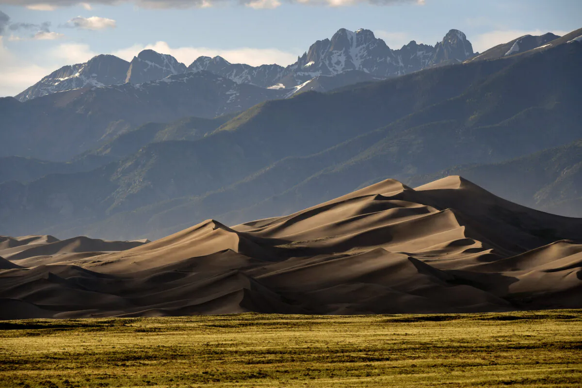 The Great Sand Dunes are lit by the setting sun near Mosca, Colorado, on June 19, 2019. (Helen H. Richardson/The Denver Post/TNS)