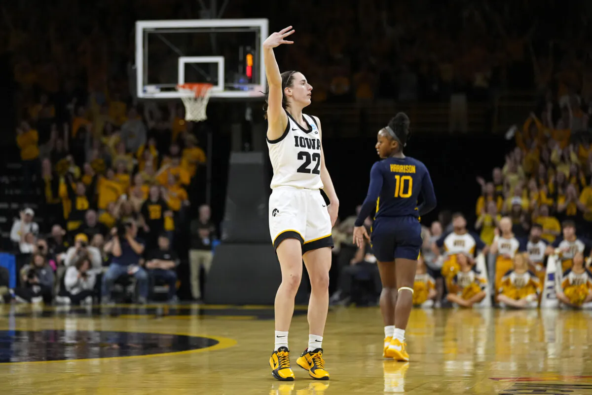 Iowa guard Caitlin Clark (22) celebrates after making a three-point basket in the second half of a second-round college basketball game against West Virginia in the NCAA Tournament in Iowa City, Iowa, on March 25, 2024. (Charlie Neibergall/AP Photo)