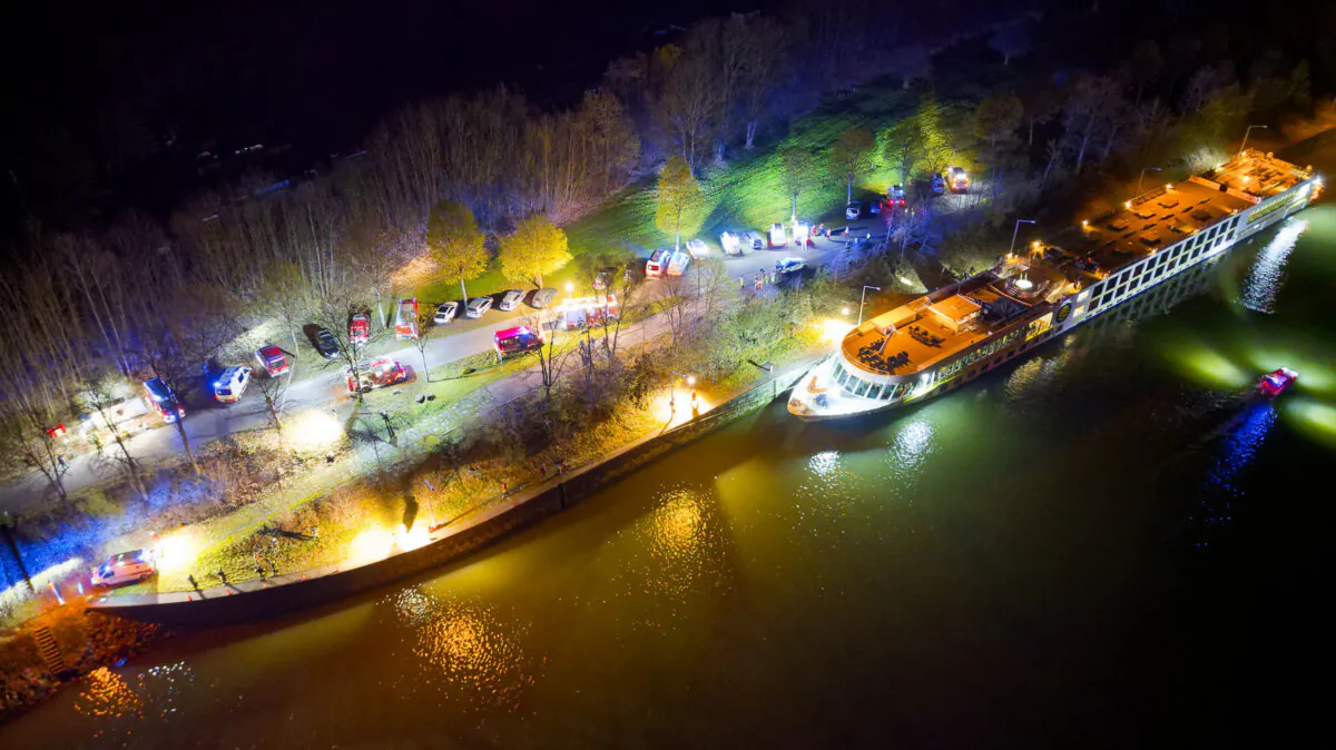 An aerial photo shows a Bulgarian cruise ship in the lock area after it crashed into a concrete wall in the night of March 29, 2024, in Aschach an der Donau, upper Austria. (Martin Scharinger/TEAM FOTOKERSCHI/APA/AFP via Getty Images)