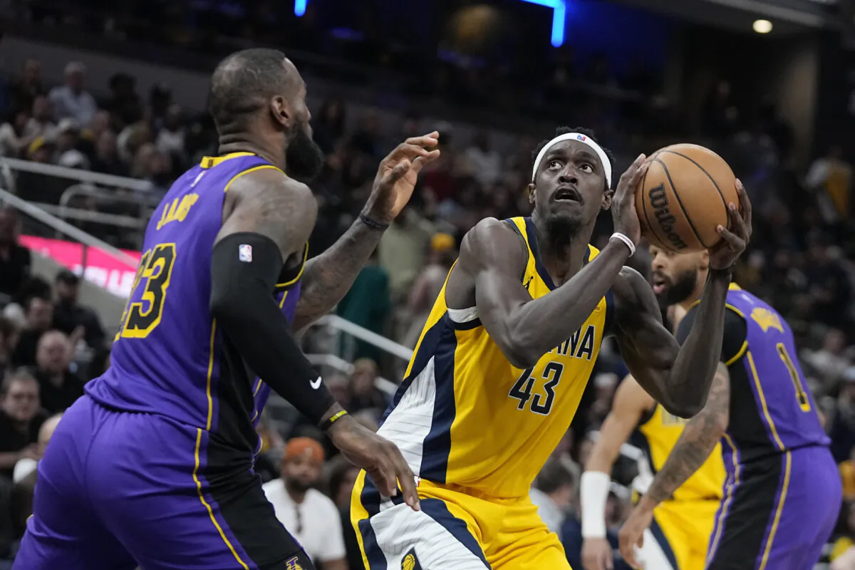 Indiana Pacers' Pascal Siakam (43) shoots against Los Angeles Lakers' LeBron James (23) during the second half of an NBA basketball game in Indianapolis on March 29, 2024. (Darron Cummings/AP Photo)