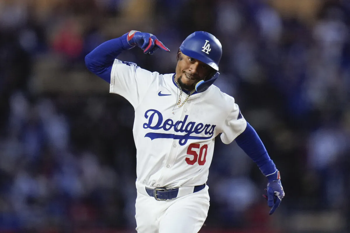 Los Angeles Dodgers' Mookie Betts celebrates his home run during the first inning of a baseball game against the St. Louis Cardinals in Los Angeles on March 29, 2024. (Jae C. Hong/AP Photo)