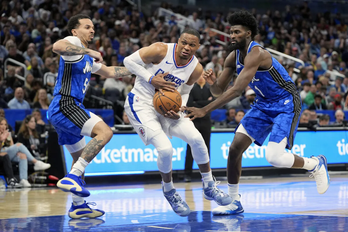 Los Angeles Clippers guard Russell Westbrook (C) goes to the basket between Orlando Magic guard Cole Anthony (L) and forward Jonathan Isaac (1) during the second half of an NBA basketball game in Orlando on March 29, 2024. (John Raoux/AP Photo)