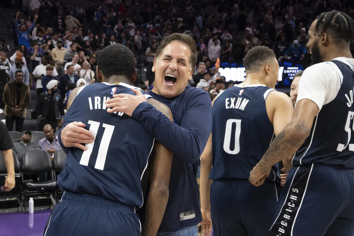 Mark Cuban embraces Dallas Mavericks guard Kyrie Irving after the Mavericks defeated the Sacramento Kings in an NBA basketball game in Sacramento, Calif., on March 29, 2024. (José Luis Villegas/AP Photo)