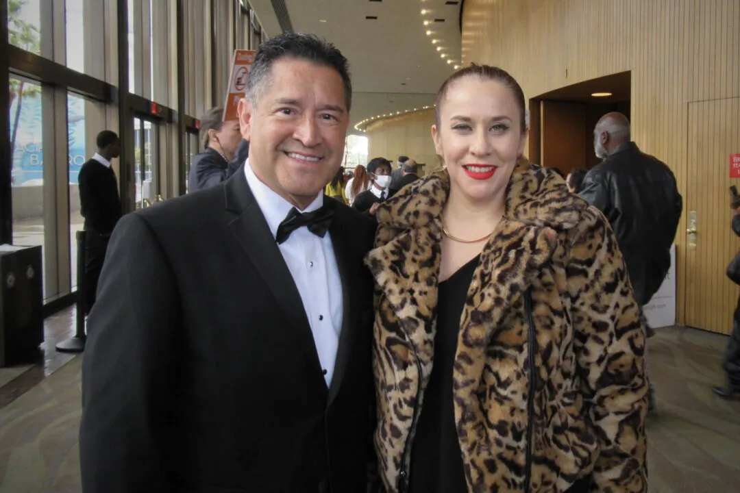 Sergio Gascon (L) with a friend enjoyed Shen Yun's matinee at the Terrace Theater on March 31, 2024. (Michael Ren/The Epoch Times)
