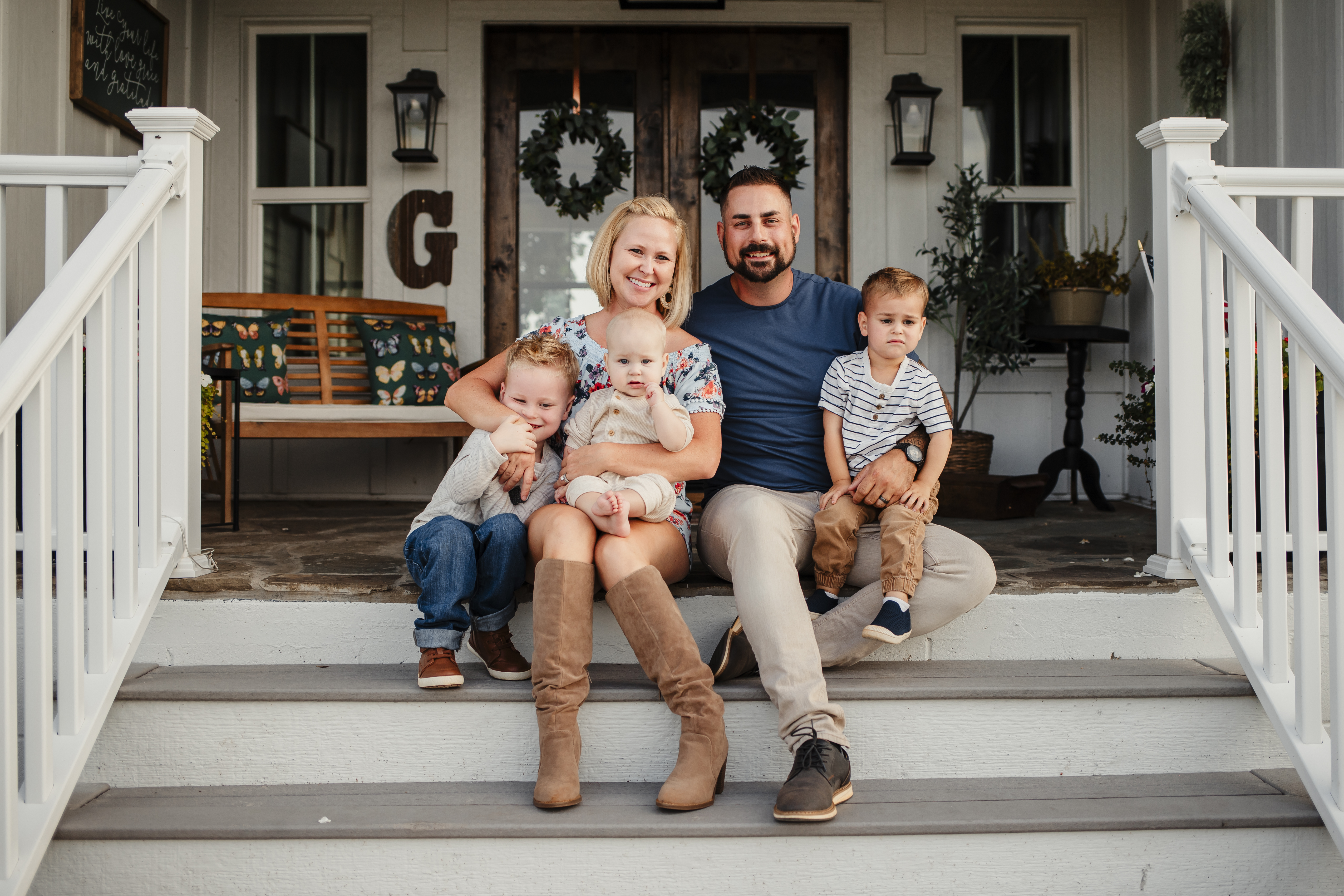 Mr. and Mrs. Grandchamp with their kids outside their 200-year-old house.
