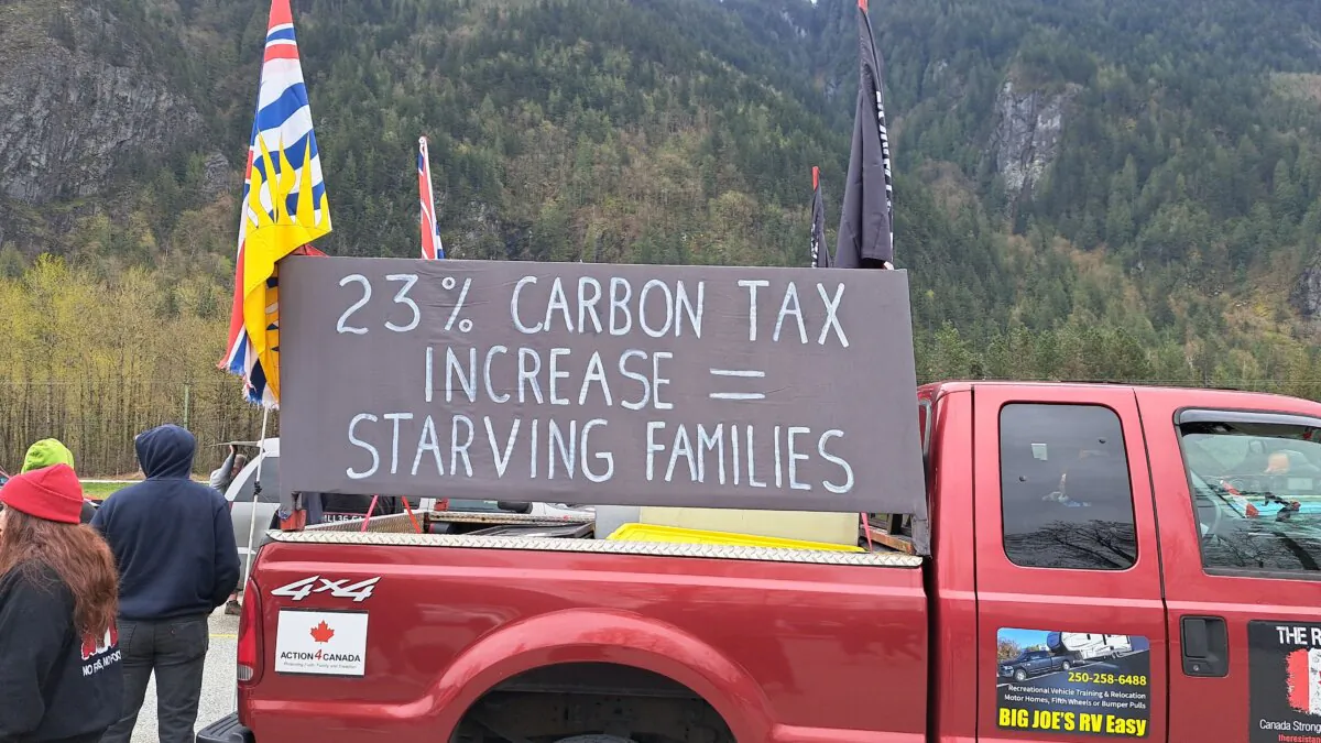 Anti-carbon tax protesters take part in a demonstrartion near Hope, B.C., on April 1, 2024 to protest the federal carbon tax increase. (Jeff Sandes/The Epoch Times)