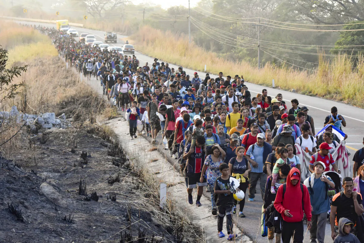Illegal immigrants walk along the highway through Arriaga in Chiapas state, Southern Mexico, on Jan. 8, 2024. (Edgar H. Clemente/AP Photo)