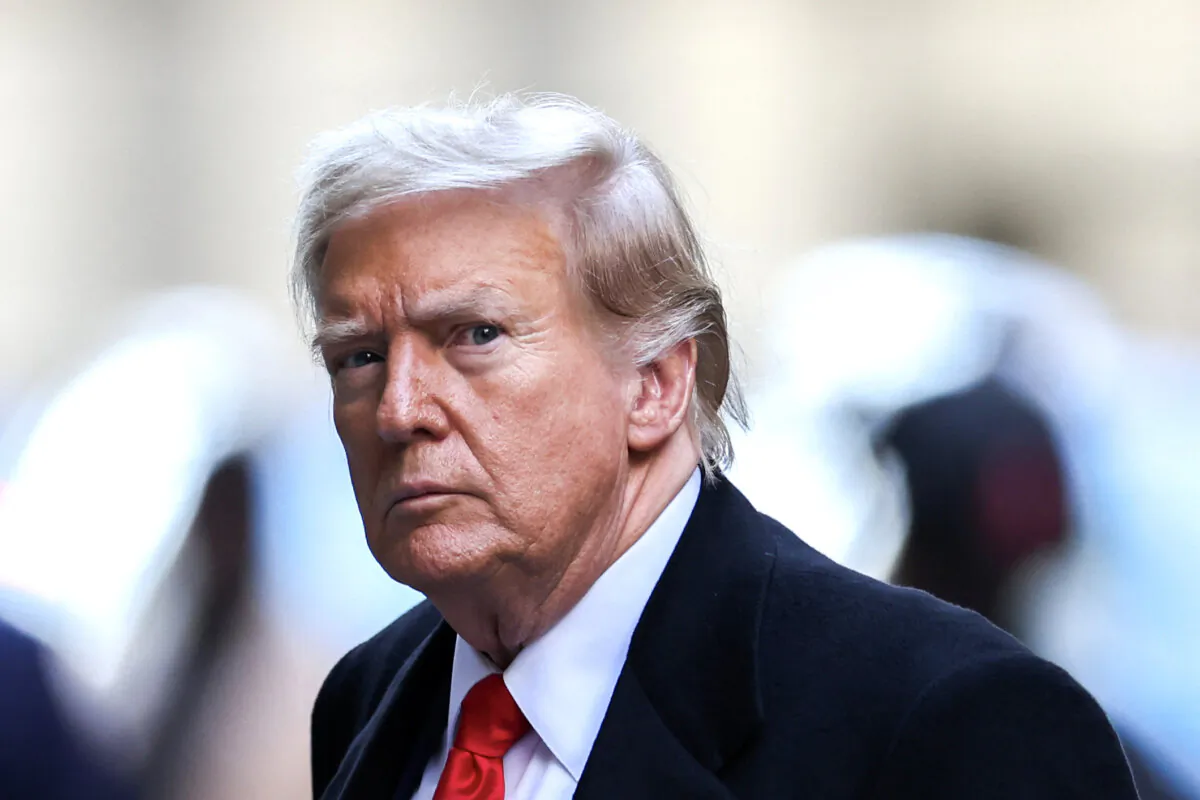 Former President Donald Trump arrives at 40 Wall Street after his court hearing to determine the date of his trial for allegedly covering up hush money payments linked to extramarital affairs, in New York City on March 25, 2024. (Charly Triballeau/AFP via Getty Images)