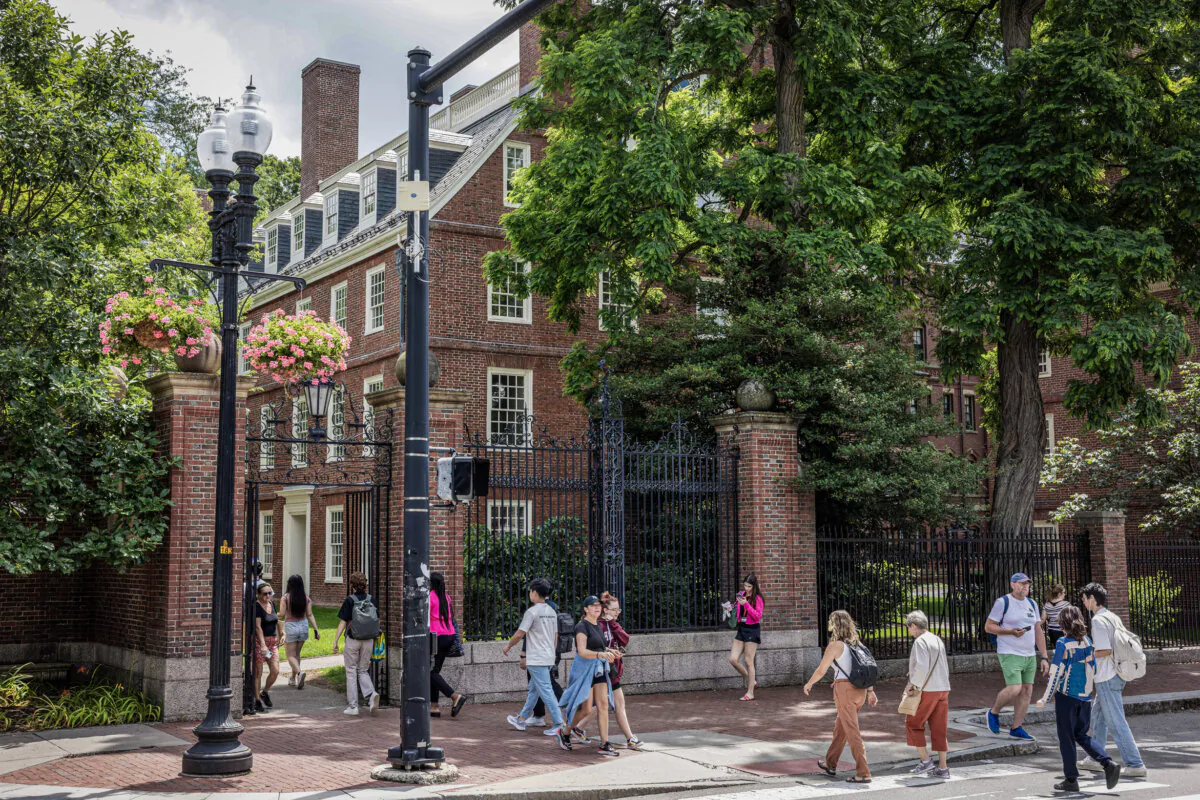 People walk through the gate on Harvard Yard at the Harvard University campus in Cambridge, Mass., on June 29, 2023. (Scott Eisen/Getty Images)