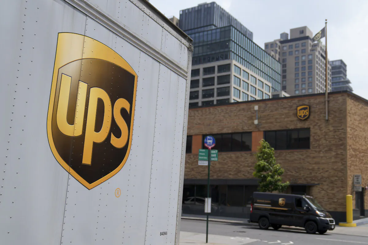A delivery vehicle passes by a UPS depot, in New York on June 29, 2023. (John Minchillo/AP Photo)