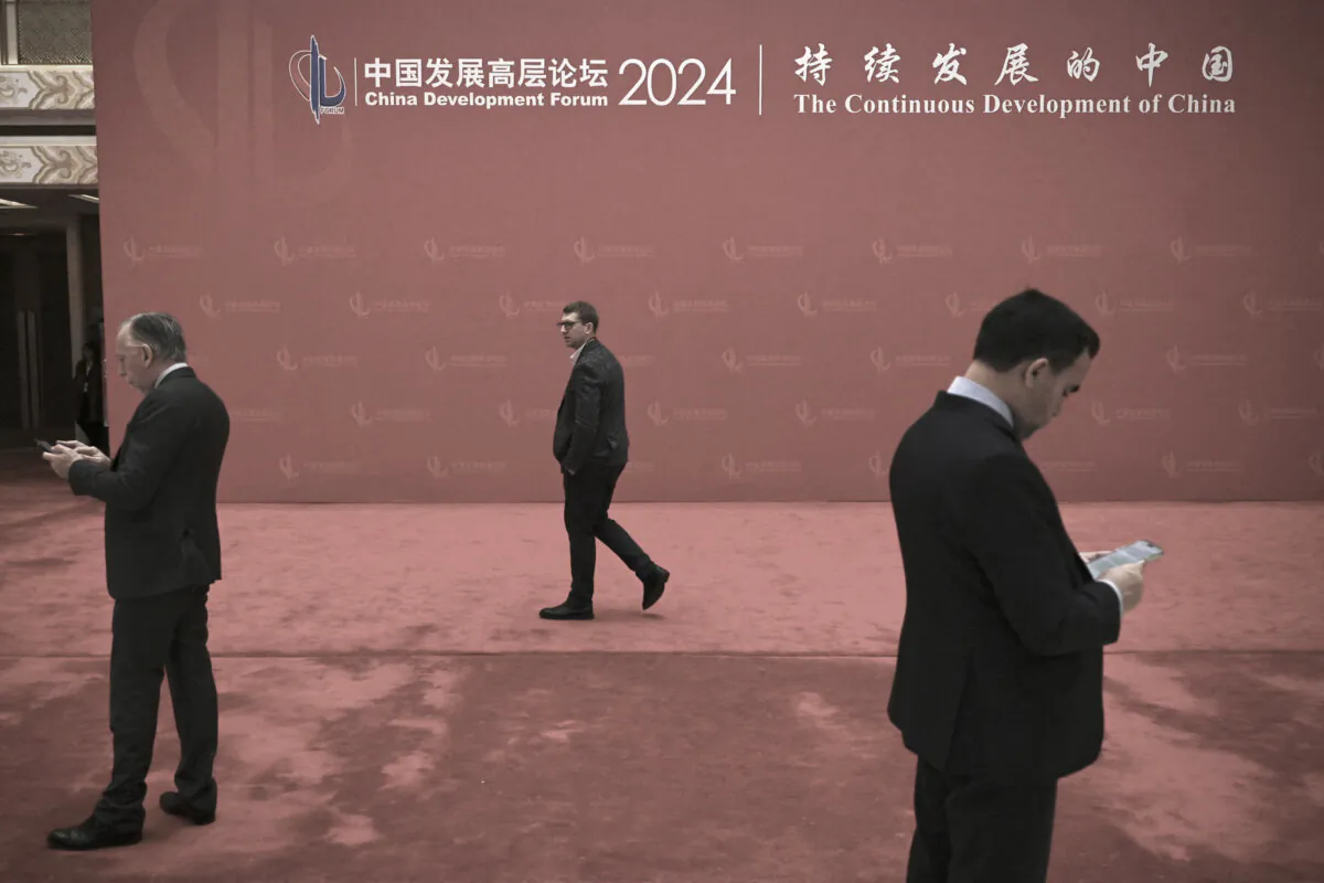 Attendees are seen at the China Development Forum in Beijing on March 25, 2024. (Pedro Pardo/AFP via Getty Images)