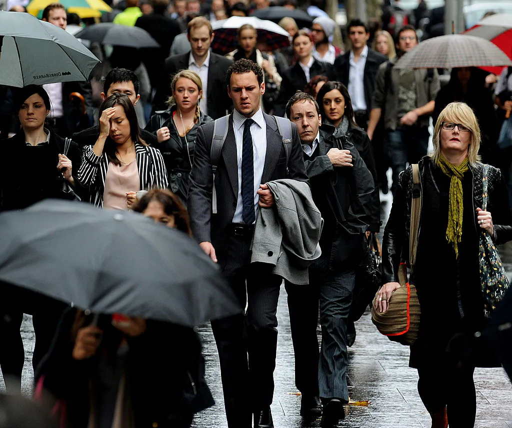 People make their way to work in the central business district of Sydney, Australia, in a file photo. (Greg Wood/AFP via Getty Images)