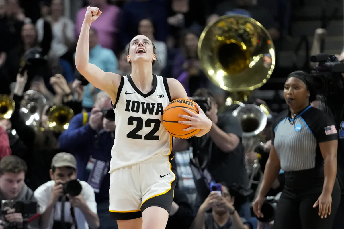 Iowa star Caitlin Clark celebrates after the Hawkeyes defeated LSU in an NCAA regional final game in Albany, N.Y., on April 1. (Mary Altaffer/AP Photo)