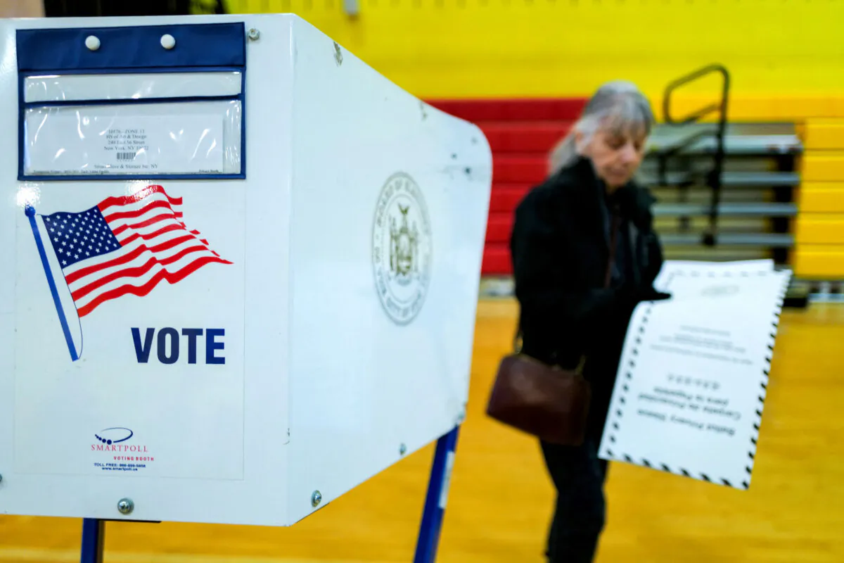 People vote at a Manhattan polling station during the New York state presidential primary election, on April 2, 2024. (Charly Triballeau/AFP via Getty Images)