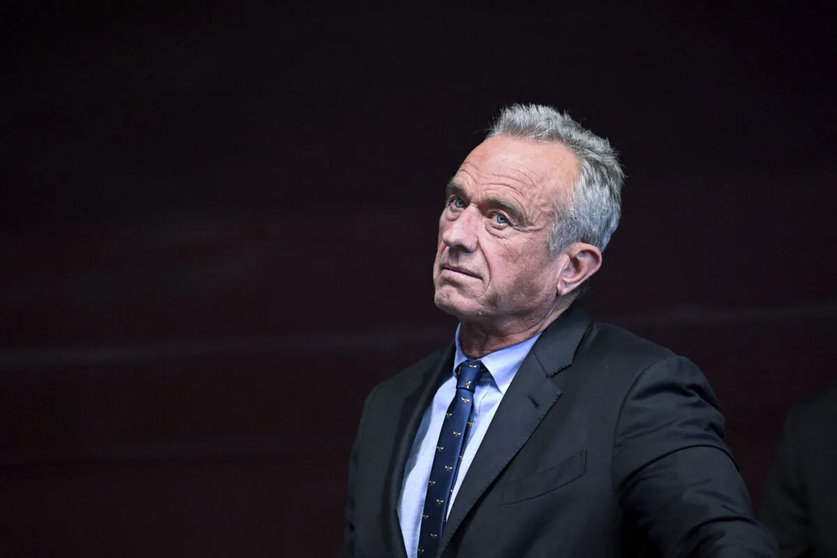 Independent presidential candidate Robert F. Kennedy Jr. watches his running mate Nicole Shanahan speak during a campaign event at the Henry J. Kaiser Event Center in Oakland, Calif., on March 26, 2024. (Josh Edelson/AFP via Getty Images)