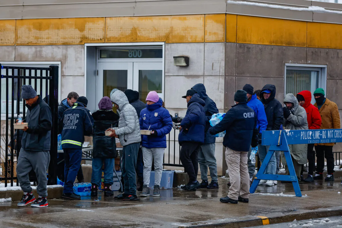 Immigrants receive food in Chicago, on Jan. 12, 2024. (Kamil Krzaczynski/AFP via Getty Images)