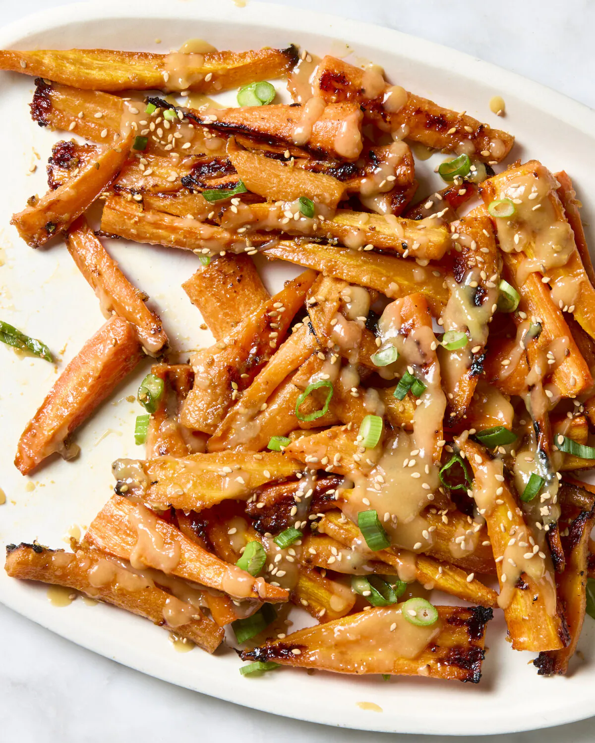 Miso is a fantastic ingredient that makes simple roasted carrots into something magical. (Alex Lepe/TNS)