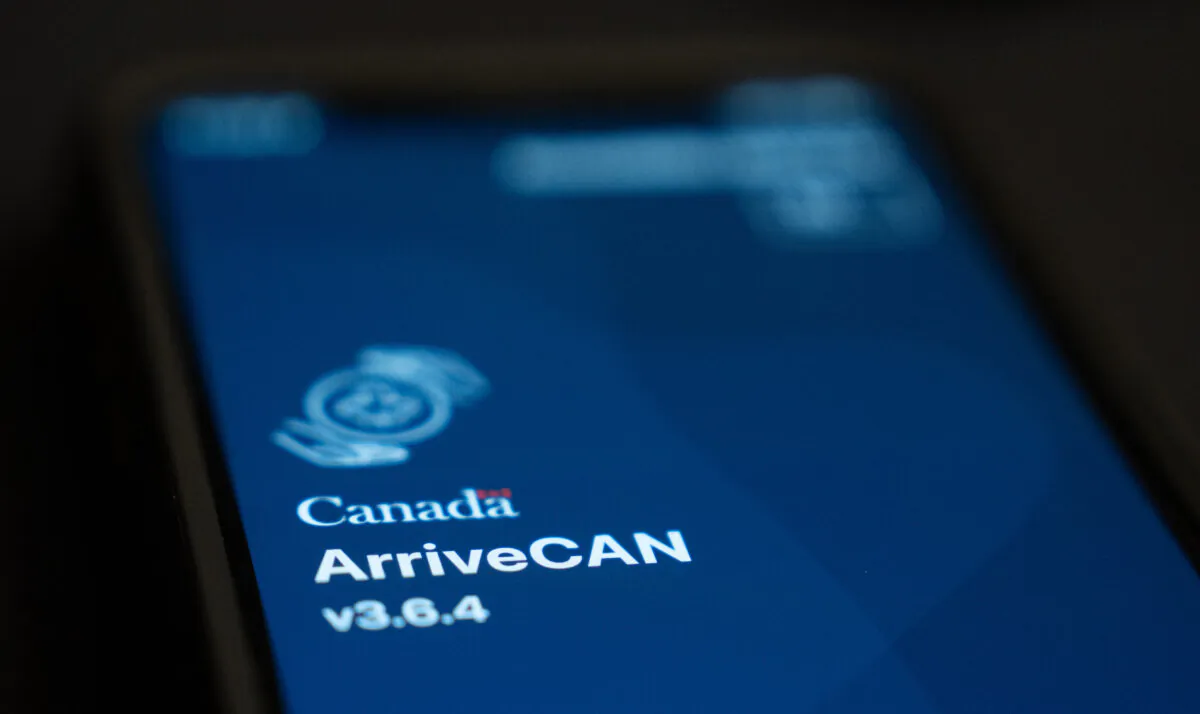 Canada's ArriveCan app log-in screen is seen on a mobile device in Ottawa on Feb. 12, 2024. (The Canadian Press/Adrian Wyld)