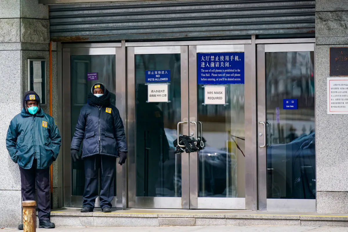 Guards stand outside of the Chinese Consulate in New York on March 28, 2022. (Seth Wenig/AP Photo)