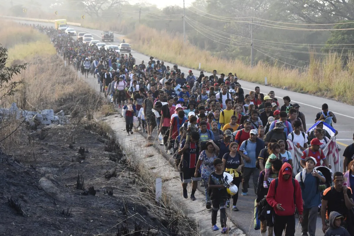 Illegal immigrants walk along the highway through Arriaga, Chiapas, Mexico, on Jan. 8, 2024, during their journey north toward the U.S. border. (Edgar H. Clemente/AP Photo)