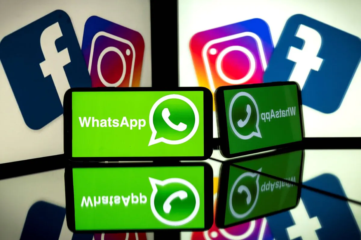 Logos of Facebook, Instagram, and mobile messaging service WhatsApp on the screens of a smartphone and a tablet in Toulouse, southwestern France, on Oct. 5, 2020. (Lionel Bonaventure/AFP via Getty Images)
