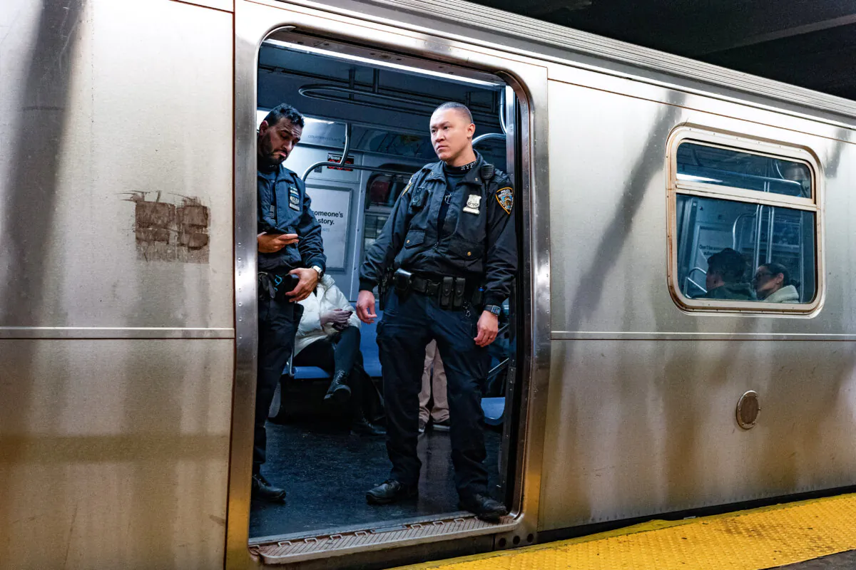 NYPD officers stand aboard a train at the West Fourth Street subway station, in New York, on Jan. 13, 2024. (Peter K. Afriyie/AP Photo, File)