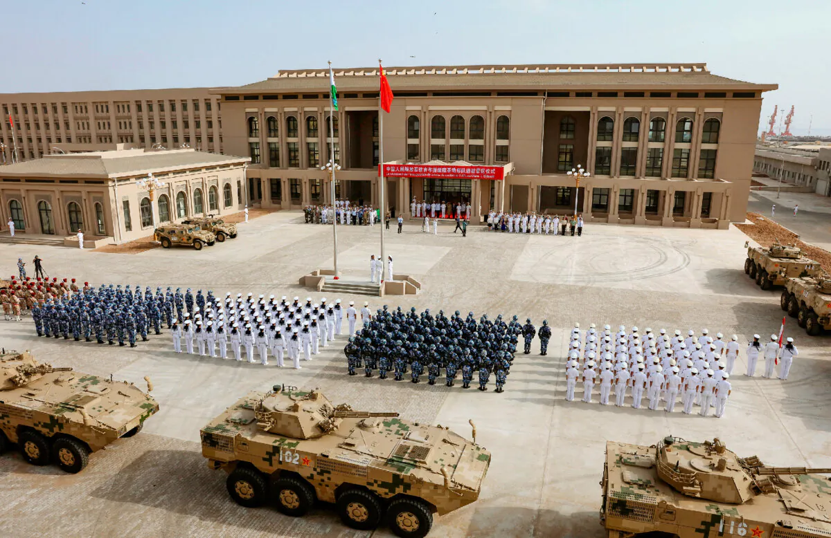 Chinese People's Liberation Army personnel attend the opening ceremony of China's new military base in Djibouti on Aug. 1, 2017. China has deployed troops to its first overseas naval base in Djibouti, a major step forward for the country's expansion of its military presence abroad. (STR/AFP via Getty Images)
