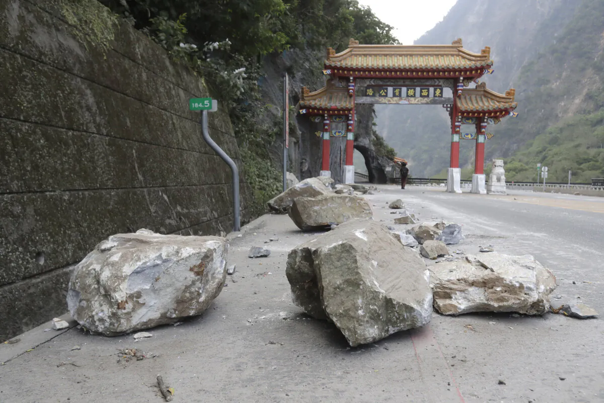 Rocks are on the road at the entrance of Taroko National Park in Hualien County, eastern Taiwan, on April 4, 2024. (The Canadian Press/Chiang Ying-ying)