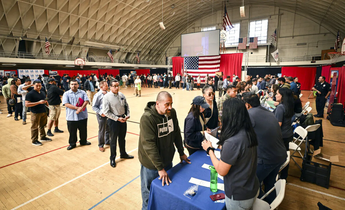 People wait in line to speak with prospective employers during a career fair in Los Angeles on Nov. 2, 2023. (Frederic J. Brown/AFP via Getty Images)