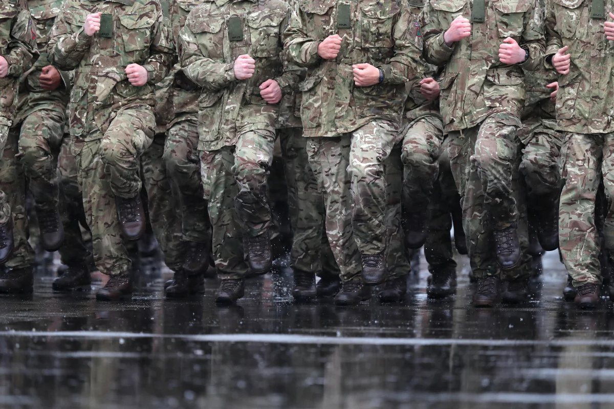 File photo dated 27/02/2017 of Members of the 4th Battalion The Rifles march in the rain at Normandy Barracks, in Aldershot, England, on Feb. 27, 2017. (Andrew Matthews/PA Wire)