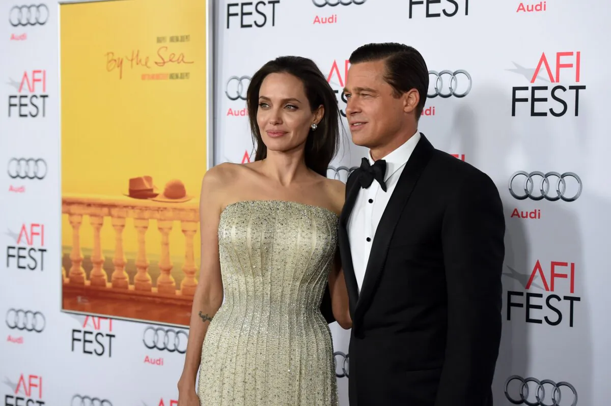 Writer-director-producer-actress Angelina Jolie Pitt (L) and actor-producer Brad Pitt attend the opening night gala premiere of Universal Pictures' "By the Sea" during AFI FEST 2015 presented by Audi at TCL Chinese 6 Theatres in Hollywood, Calif., on Nov. 5, 2015. (Kevin Winter/Getty Images)