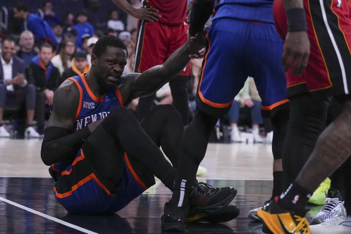 Julius Randle (30) of the New York Knicks reacts after an injury against the Miami Heat in the second half at Madison Square Garden in New York City on Jan. 27, 2024. (Mitchell Leff/Getty Images)